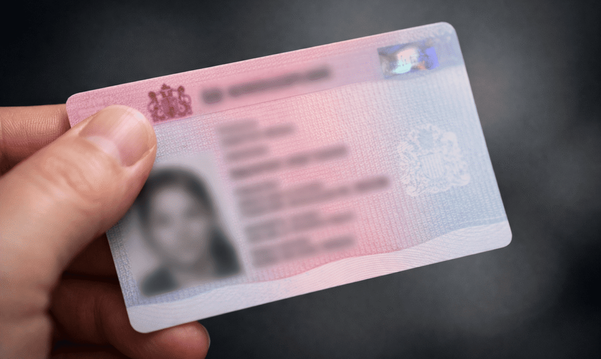 man holding skilled work visa for child